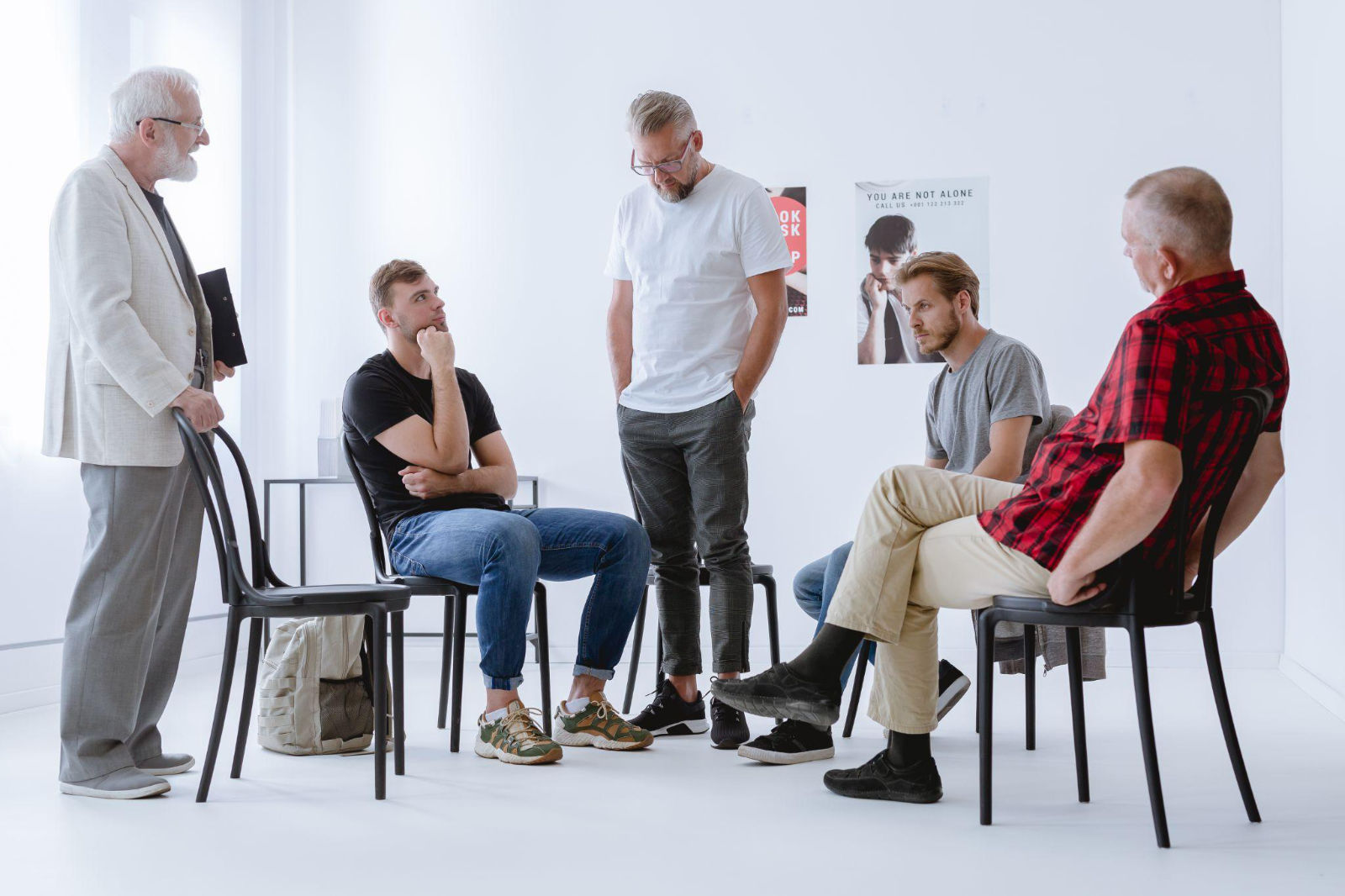 Group of men participating in a supportive residential recovery therapy session